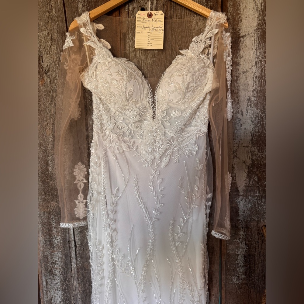 Beaded White Lace Bridal Gown with Sheer Long Sleeves. Worn for 2 hours